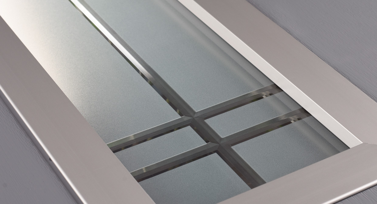 Linear decorative composite door glass