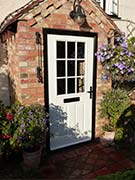 white cottage style composite front door