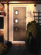 black composite door with grey frame