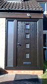 grey composite door with grey frame